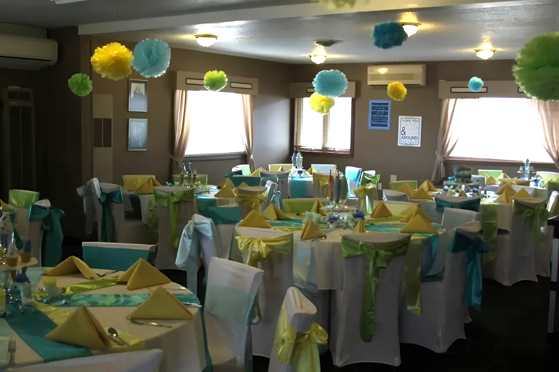 The Legends banquet room at The Ridges Golf Course, featuring multiple decorated tables and chairs